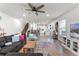 Open-concept living area with a large sectional couch at 3798 Plainview Dr, Orlando, FL 32824