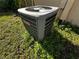 Goodman central air conditioning unit surrounded by greenery and set alongside the home's exterior at 111 2Nd St # Jpv, Winter Haven, FL 33880