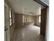 Simple bedroom with tile flooring, natural light, and a ceiling fan, offering a blank canvas for customization at 111 2Nd St # Jpv, Winter Haven, FL 33880