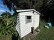 Outdoor shed provides additional storage space and is nestled in a garden environment at 111 2Nd St # Jpv, Winter Haven, FL 33880