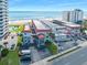 Aerial view of condominiums with beachfront access, on-site parking, and ocean views at 1404 N Atlantic Ave # 270, Daytona Beach, FL 32118