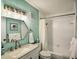 Well-lit bathroom with vanity, mirror, and a shower-tub combination at 1404 N Atlantic Ave # 270, Daytona Beach, FL 32118