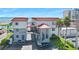 Charming condominium with red roof, beach views, palm trees, and convenient parking at 1404 N Atlantic Ave # 270, Daytona Beach, FL 32118