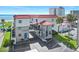 Charming condominium with red roof, beach views, palm trees, and convenient parking at 1404 N Atlantic Ave # 270, Daytona Beach, FL 32118