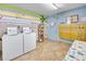 Laundry room with beachy decor, mailboxes, bulletin board, offering convenience and community charm at 1404 N Atlantic Ave # 270, Daytona Beach, FL 32118