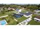 An aerial view of a well-maintained backyard featuring a screened pool and lush landscaping at 5029 Sheffield Rd, Lakeland, FL 33813