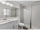 Modern bathroom with a glass-enclosed shower, a vanity with stylish fixtures, and ample lighting for a spa-like experience at 5029 Sheffield Rd, Lakeland, FL 33813