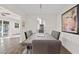 Spacious dining room with modern lighting fixture and view into kitchen at 5029 Sheffield Rd, Lakeland, FL 33813