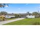 Well-maintained home with a paved driveway at 5029 Sheffield Rd, Lakeland, FL 33813