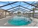 Outdoor pool with screen enclosure; the perfect oasis for swimming and entertaining at 5029 Sheffield Rd, Lakeland, FL 33813