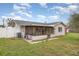 Charming home with a screened porch, mature landscaping, and fenced yard at 5105 Se 25Th St, Ocala, FL 34480