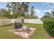 Backyard patio with a barbecue and storage shed at 5105 Se 25Th St, Ocala, FL 34480