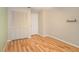 Bright bedroom features wood-look flooring, a closet with double doors, and a neutral color palette at 5105 Se 25Th St, Ocala, FL 34480