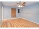 Bedroom with hard surface flooring, a ceiling fan, and neutral colored walls at 5105 Se 25Th St, Ocala, FL 34480