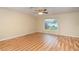 Bright bedroom with hardwood flooring, a ceiling fan, and natural light at 5105 Se 25Th St, Ocala, FL 34480