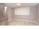 Bright kitchen area with stainless steel refrigerator, tan tile flooring and large window at 5105 Se 25Th St, Ocala, FL 34480