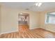 Bright living room with light hardwood flooring and large windows offering plenty of natural light at 5105 Se 25Th St, Ocala, FL 34480