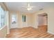 Bright living room with a ceiling fan, light hardwood flooring and large windows at 5105 Se 25Th St, Ocala, FL 34480