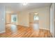 Spacious living room with wood floors and large windows allowing natural light at 5105 Se 25Th St, Ocala, FL 34480