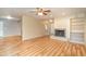 Living room with brick fireplace, built-in shelving, attractive flooring, and open floor plan at 5105 Se 25Th St, Ocala, FL 34480