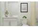 Bathroom featuring a sleek vanity with modern fixtures and a shower with elegant neutral toned curtain at 3430 Howell Dr, Lake Wales, FL 33859