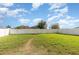 Green backyard with a white fence at 1724 Holton Rd, Lakeland, FL 33810