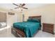 This primary bedroom features a king bed, a ceiling fan, and bright natural lighting at 1724 Holton Rd, Lakeland, FL 33810