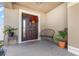 Inviting front porch featuring a decorative door and a cozy bench for relaxing at 1724 Holton Rd, Lakeland, FL 33810