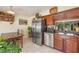 A kitchen featuring stainless steel appliances, granite countertops, and an adjacent dining area at 1724 Holton Rd, Lakeland, FL 33810