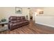 Hardwood floors and a large window in this cozy living room at 1724 Holton Rd, Lakeland, FL 33810