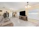 Open living room with tile floors, neutral colors and a large window at 1724 Holton Rd, Lakeland, FL 33810