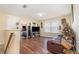 Cozy living room featuring wood floors, a TV, and a comfortable recliner at 1724 Holton Rd, Lakeland, FL 33810