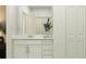 Clean bathroom with a white vanity, ample storage, and a view of the shower at 4196 Singing Mockingbird Blvd, Bartow, FL 33830