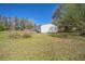 A well-maintained lawn with a cozy single-story home, offering a serene and private outdoor space at 1140 Saddlewood Blvd, Lakeland, FL 33809