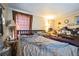 Bedroom with neutral walls, carpet, window with curtains and basic furnishings at 1140 Saddlewood Blvd, Lakeland, FL 33809