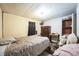 Bedroom with light walls, linoleum, window with curtains and basic furnishings at 1140 Saddlewood Blvd, Lakeland, FL 33809