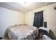 Bedroom with light walls, linoleum, window with curtains and basic furnishings at 1140 Saddlewood Blvd, Lakeland, FL 33809