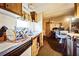 Kitchen area with wood cabinets and dated appliances at 1140 Saddlewood Blvd, Lakeland, FL 33809