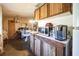 Kitchen area features wood cabinets and dated appliances at 1140 Saddlewood Blvd, Lakeland, FL 33809