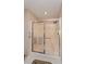 Bathroom with a glass-enclosed shower featuring a built-in bench at 2009 Salinas Ave, The Villages, FL 32159