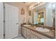 Bathroom featuring a double sink vanity, tiled floor, and a neutral color scheme at 2009 Salinas Ave, The Villages, FL 32159