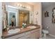 Spacious bathroom featuring a double sink vanity, large mirror, and a neutral color scheme at 2009 Salinas Ave, Lady Lake, FL 32159