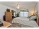 Serene bedroom with a ceiling fan, a large window, and a walk-in closet at 2009 Salinas Ave, Lady Lake, FL 32159