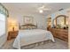 Bright bedroom with carpet, a ceiling fan, and light wood furniture at 2009 Salinas Ave, Lady Lake, FL 32159