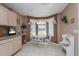 Cozy breakfast nook with a bay window and a table set for four, perfect for casual dining at 2009 Salinas Ave, Lady Lake, FL 32159