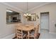 Cozy dining room featuring a pendant light fixture and kitchen view at 2009 Salinas Ave, The Villages, FL 32159