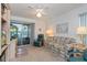 Comfortable living room with a ceiling fan and a sliding door at 2009 Salinas Ave, The Villages, FL 32159