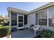 Charming patio with a small table set perfect for relaxing outdoors and enjoying the surrounding landscape at 2009 Salinas Ave, Lady Lake, FL 32159