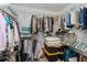 Organized walk-in closet with shelving, hanging rods, and ample storage space at 2009 Salinas Ave, The Villages, FL 32159