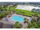 Aerial view of community pool, lake and gazebo featuring lounge chairs at 2163 Plantation Oak Dr, Orlando, FL 32824